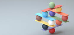 Balancing stack of balls and blocks represent hardships of academic leadership