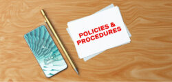 Policies and procedures with tablet and pen